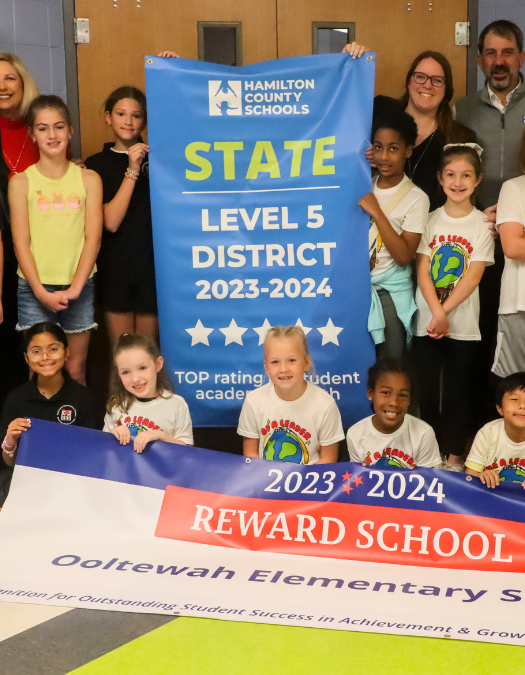 Students pose for a banner presentation photo