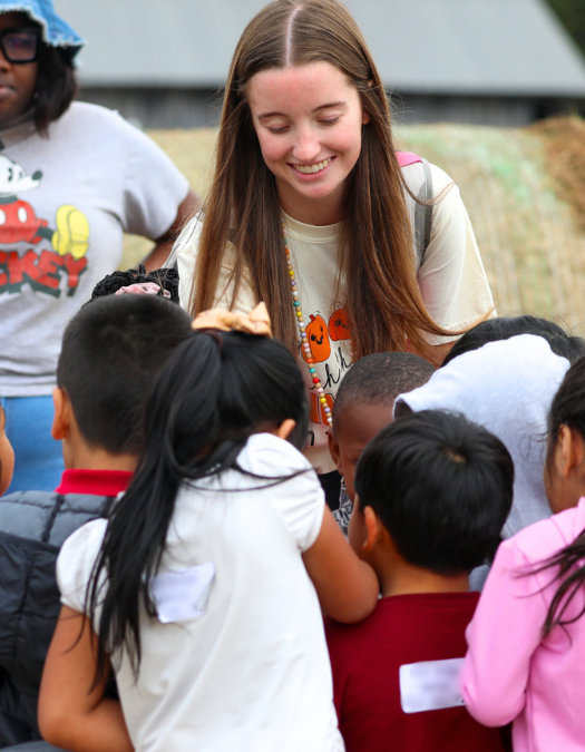 A teacher talks to students