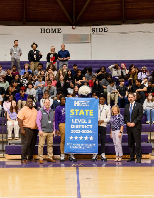 Students pose for a banner presentation photo