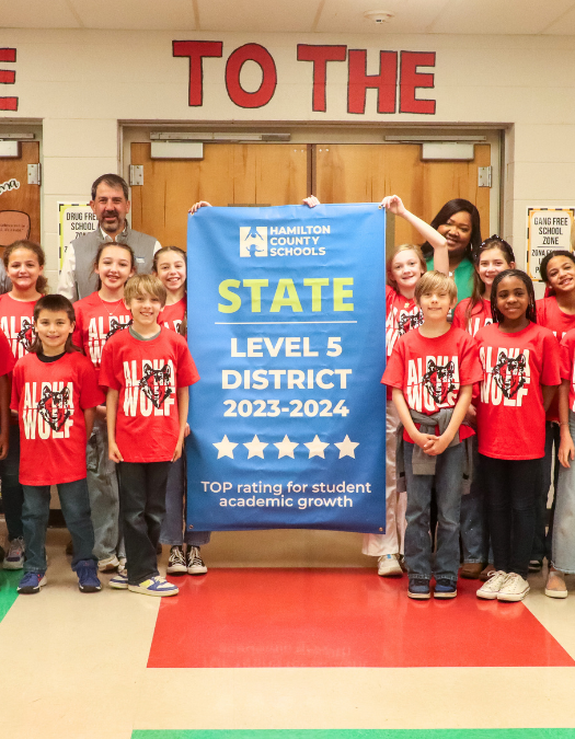 Students pose for a banner presentation photo